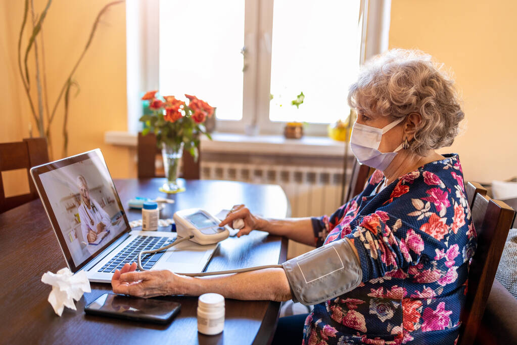 Senior woman consulting with a doctor on her laptop