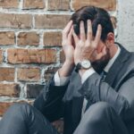 Sad man in gray suit
