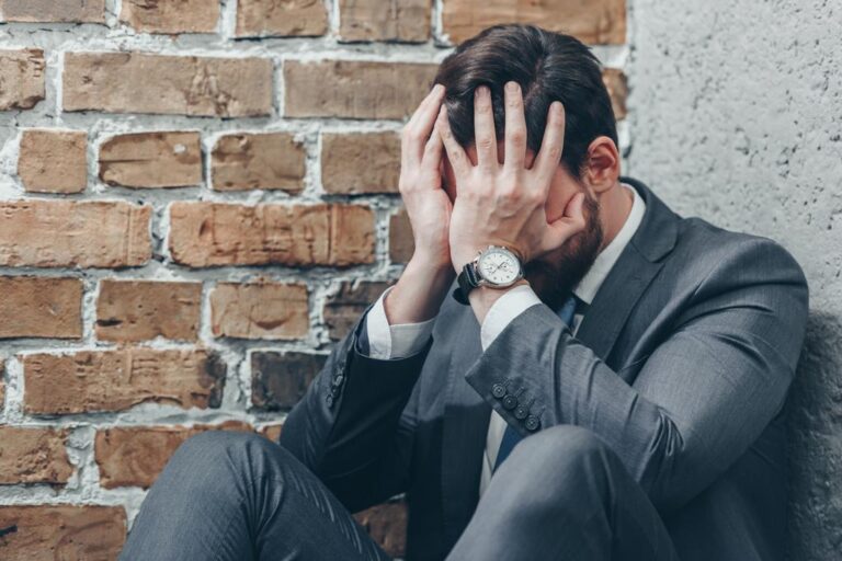 Sad man in gray suit